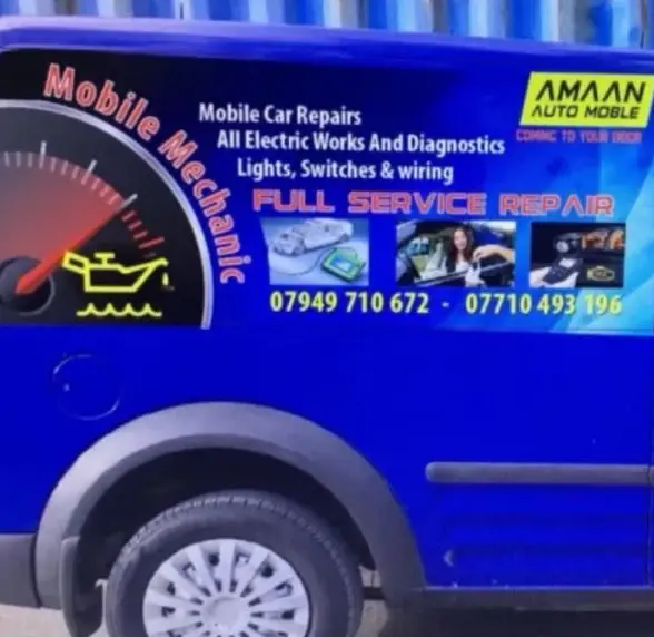 The blue Amaan Auto Mobile van, lettered Mobile Mechanic, with the yellow Amaan Auto Mobile logo
